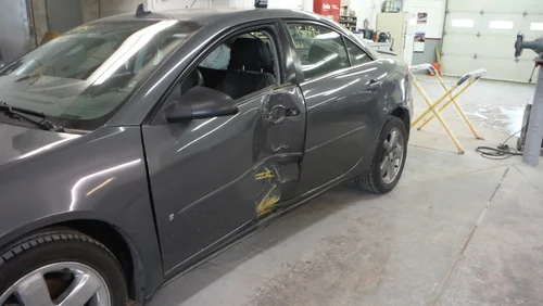 Car with a dented door from collision